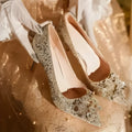 Champagne coloured pointed toe bridal heels with rhinestone patterns on a fine heel.