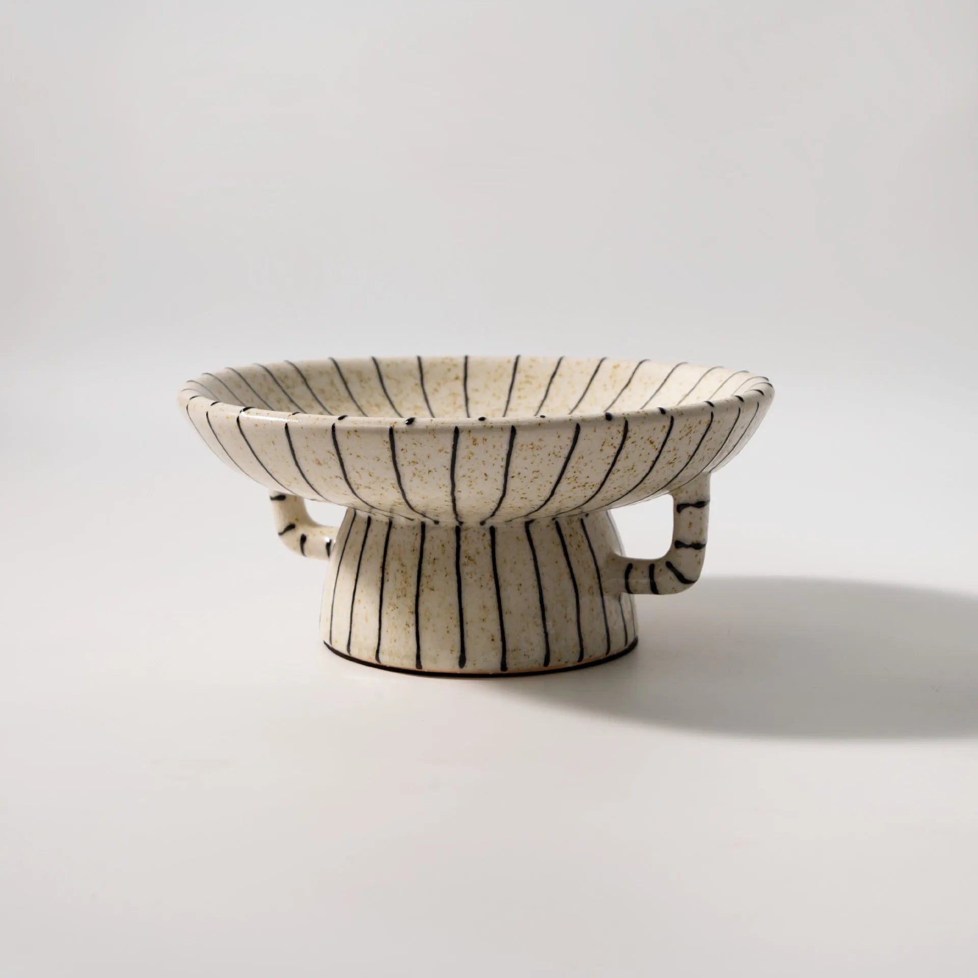 Black and white striped synthetic resin fruit plate for dessert serving