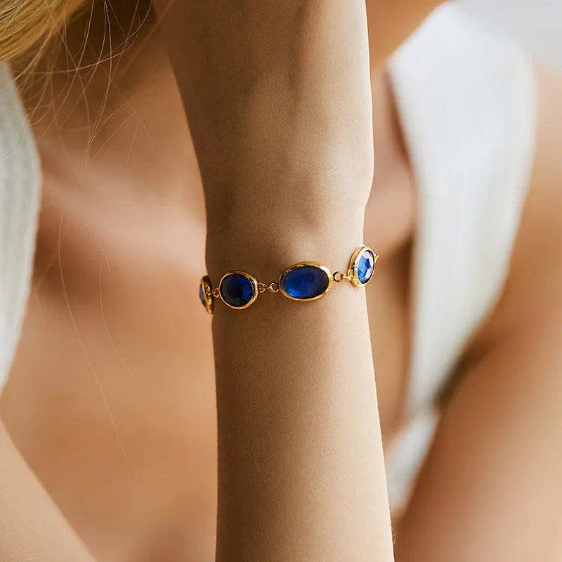 Women's geometric ellipse bracelet with 18K copper and coloured glass inlay beads in blue, green, and multicolour options