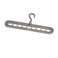 Plastic nine-hole folding pant hanger in multiple colours for dormitory wardrobe organisation
