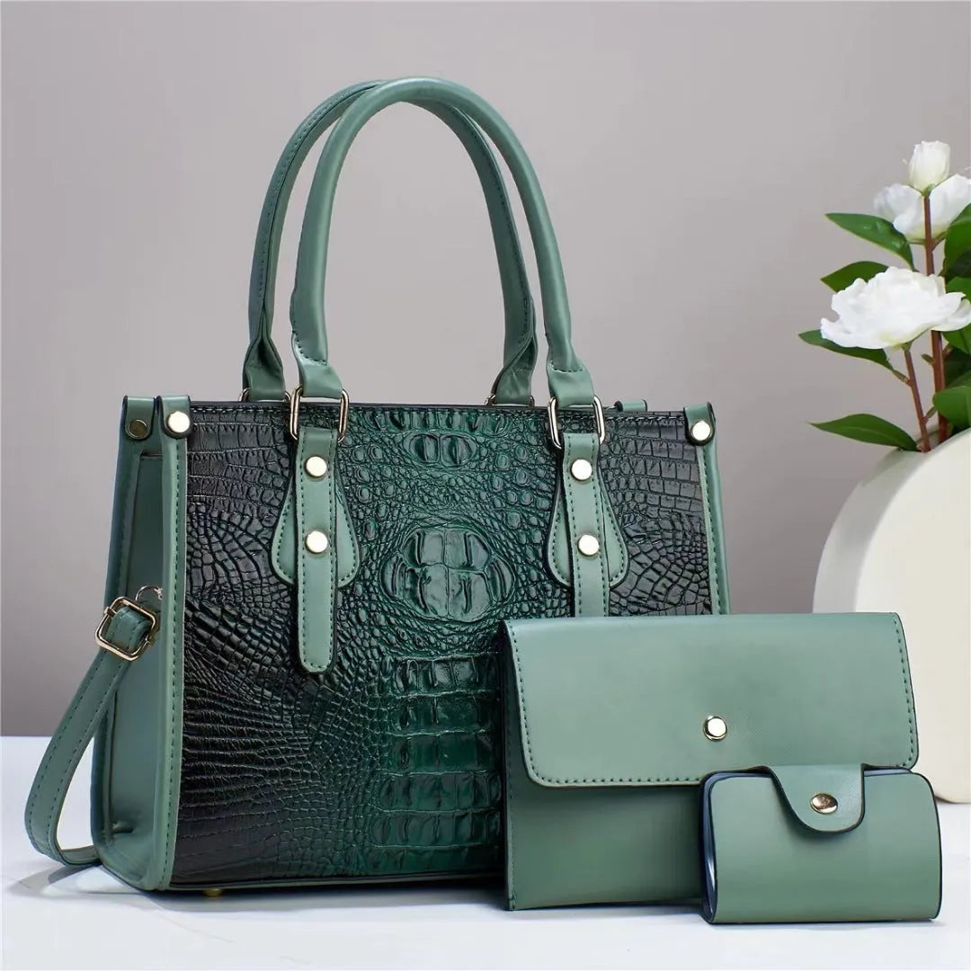 Women's textured PU leather three-piece travel bag set showing crossbody bag, wallet and card holder in coordinated colour