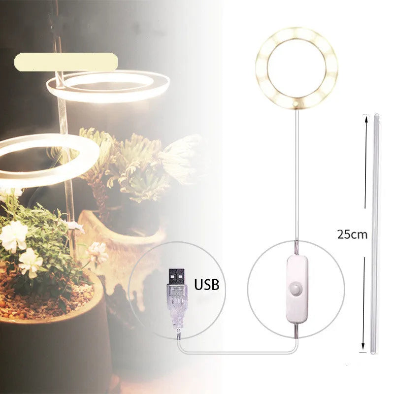 USB LED full spectrum plant grow light with acrylic stick on a table.