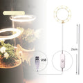 USB LED full spectrum plant grow light with acrylic stick on a table.