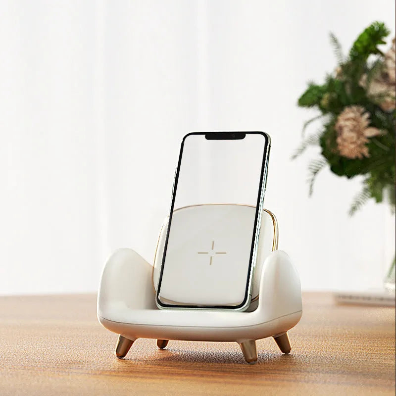 White compact wireless fast charger on a sofa, measuring 98mm by 95mm by 115mm, with USB interface