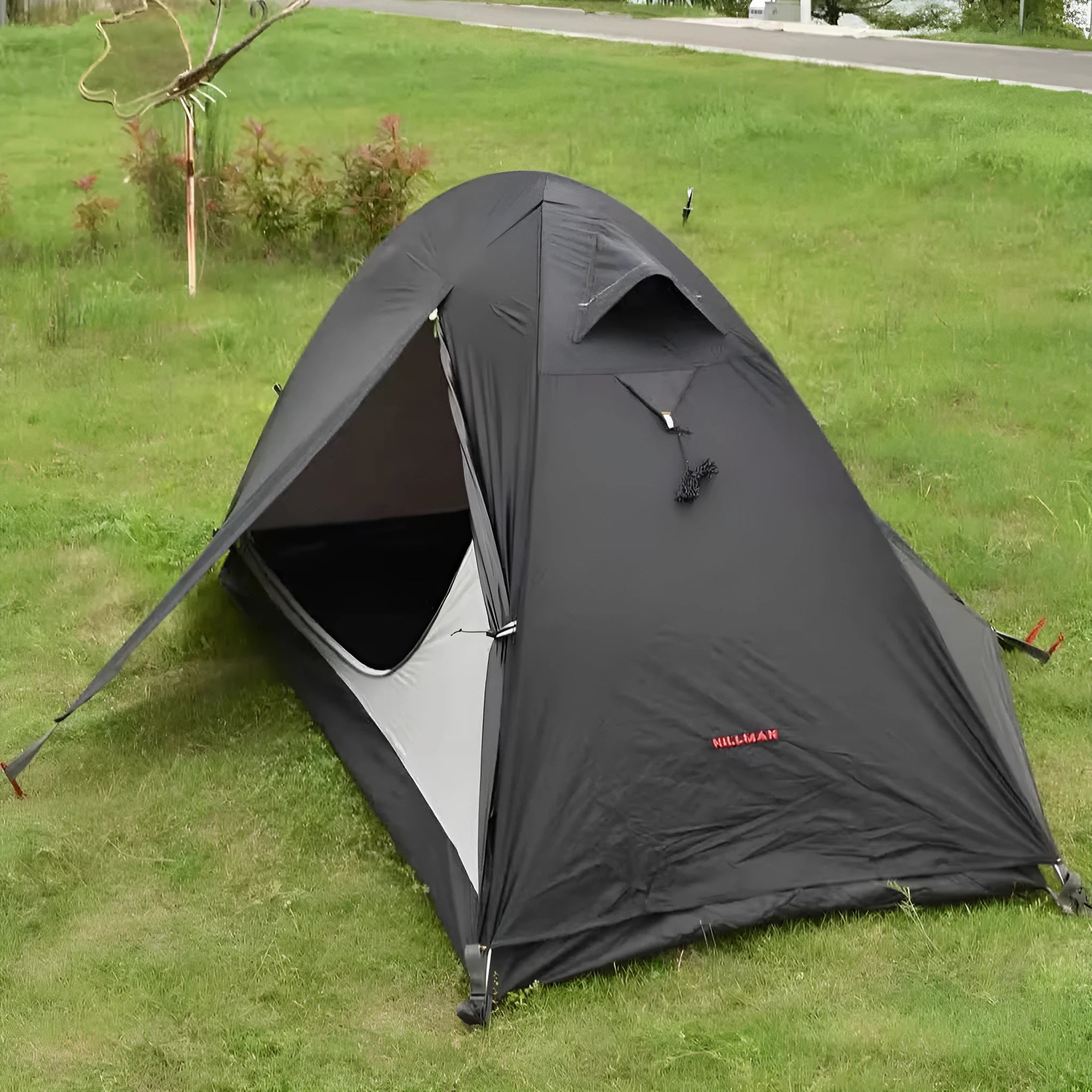 Single person tent with aluminum poles and silicon coated polyester outer layer in red black or orange