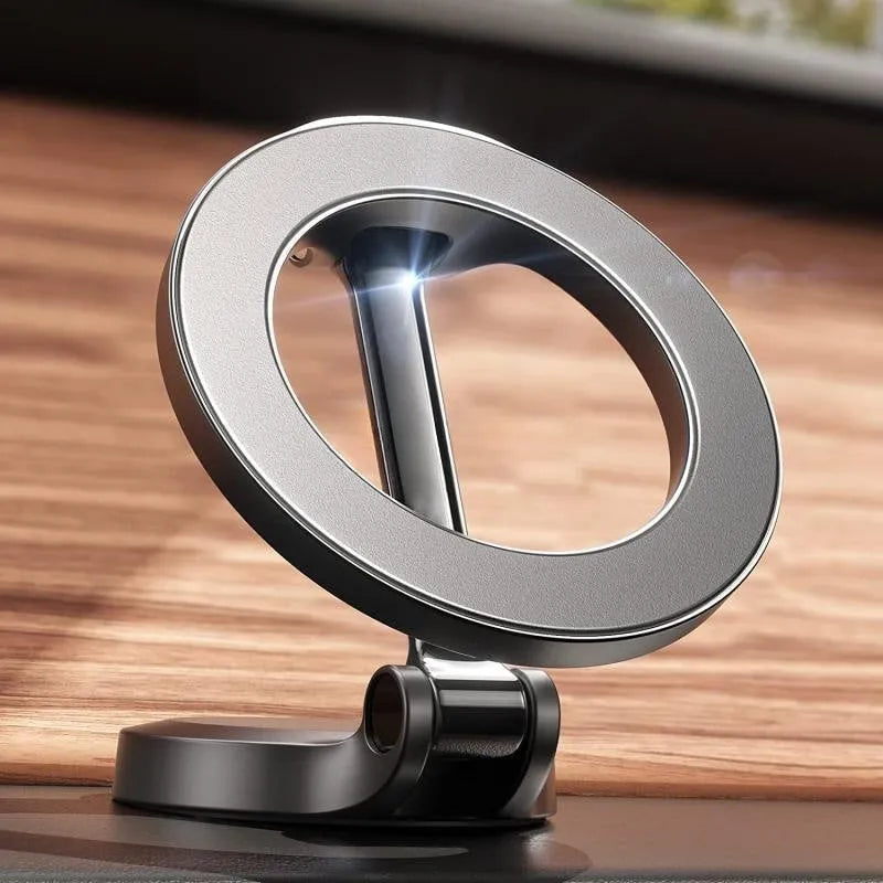 Black all-metal magnetic car phone mount with foldable bracket on vehicle dashboard