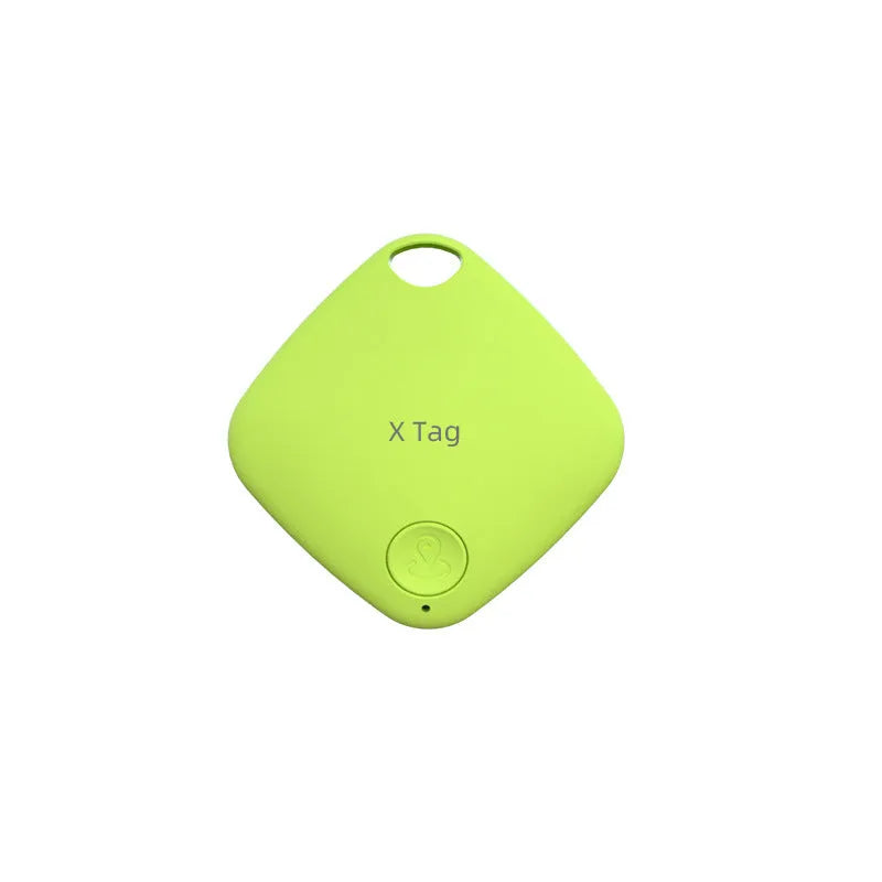 Small black Bluetooth tracker with key ring, shown next to a set of keys to illustrate size.