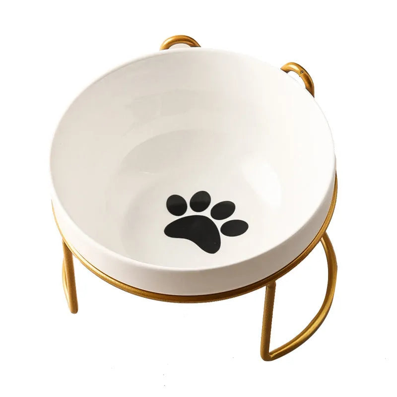 White ceramic cat bowl with decorative patterns on iron frame with cat ear details