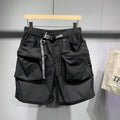 Men's loose-fitting black workwear shorts with pockets, featuring a non-iron finish and a mid-waist design.