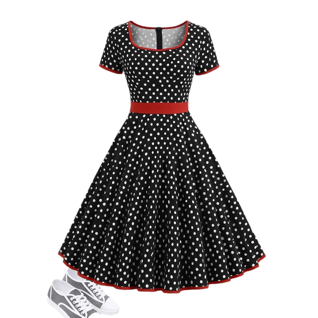 Women's multicolour polka dot pleated dress with square neckline, short sleeves, and front zip.
