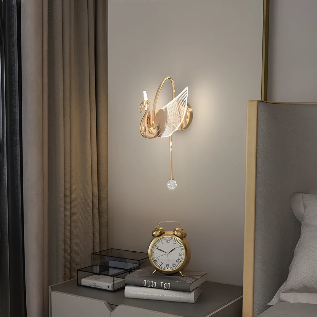 Gold modern swan-shaped wall-mounted bedside lamp with acrylic shade and dimmable LED light.