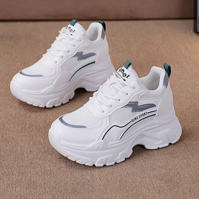 Women's beige and white height increasing dad shoes with mesh upper and cross shoulder straps.