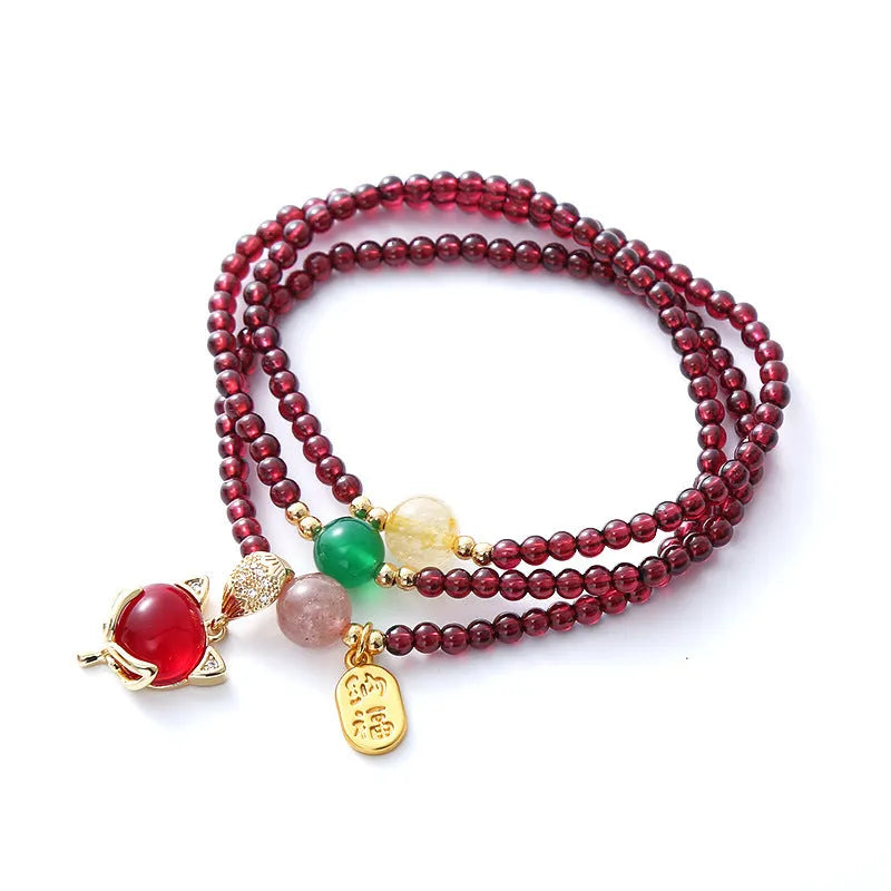 Women's adjustable garnet fox bracelet with rope closure in purplish red colour