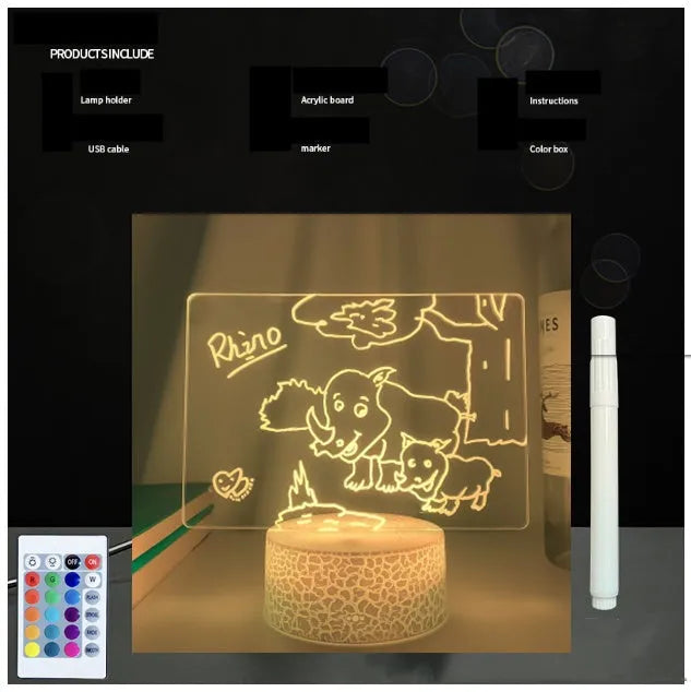 Black 3D LED handwritten acrylic message board with remote control on a desk.
