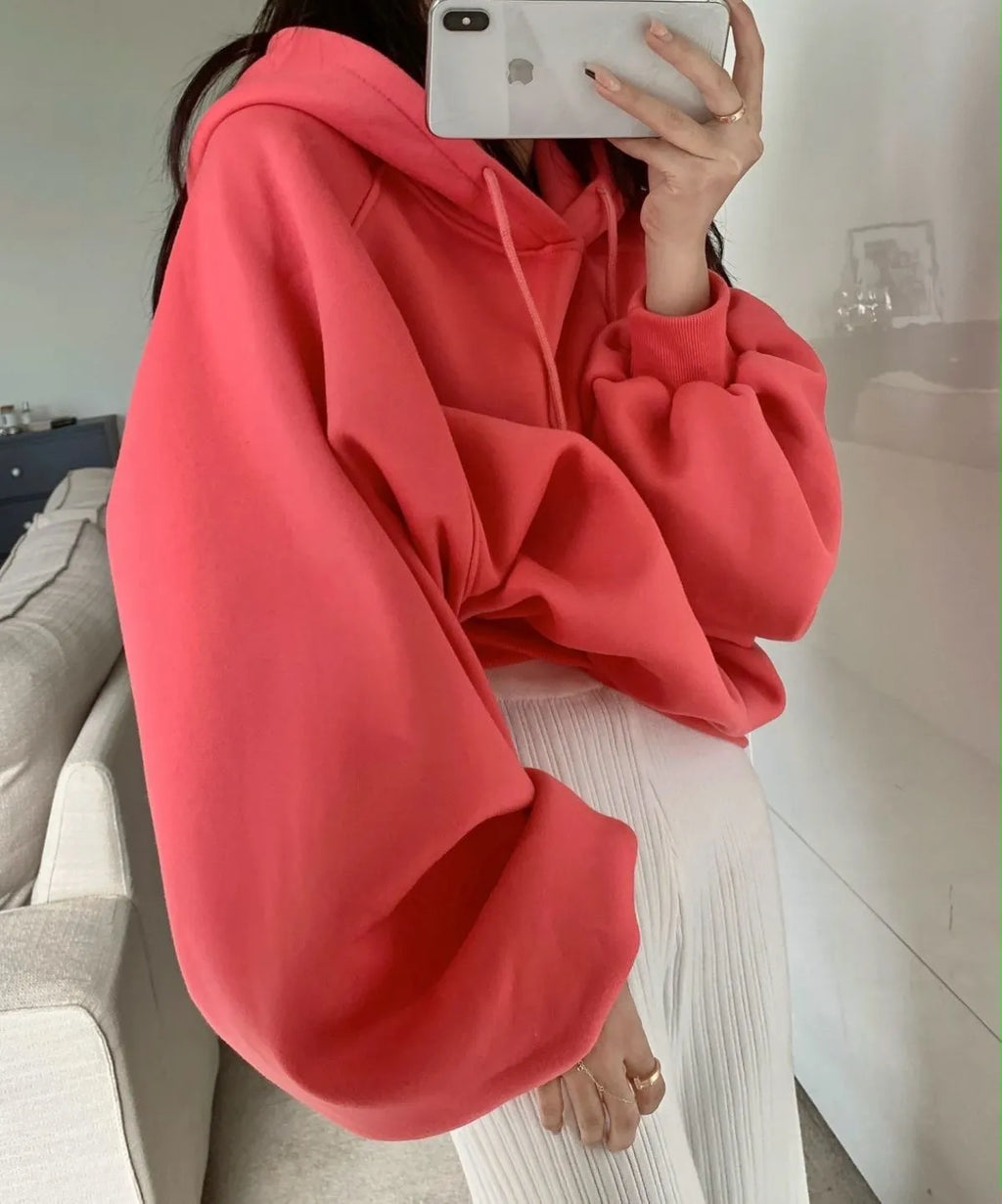 Watermelon red women's loose fit mulberry silk hooded sweater on a hanger.