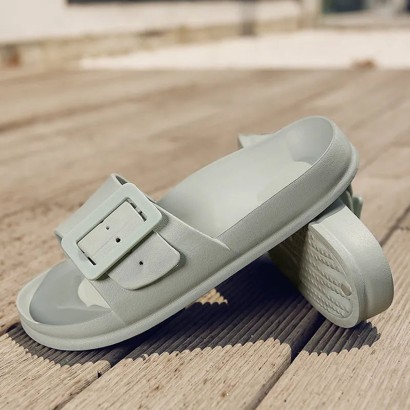 Women's grey blue flip-flop slippers with a buckle strap and soft EVA sole.