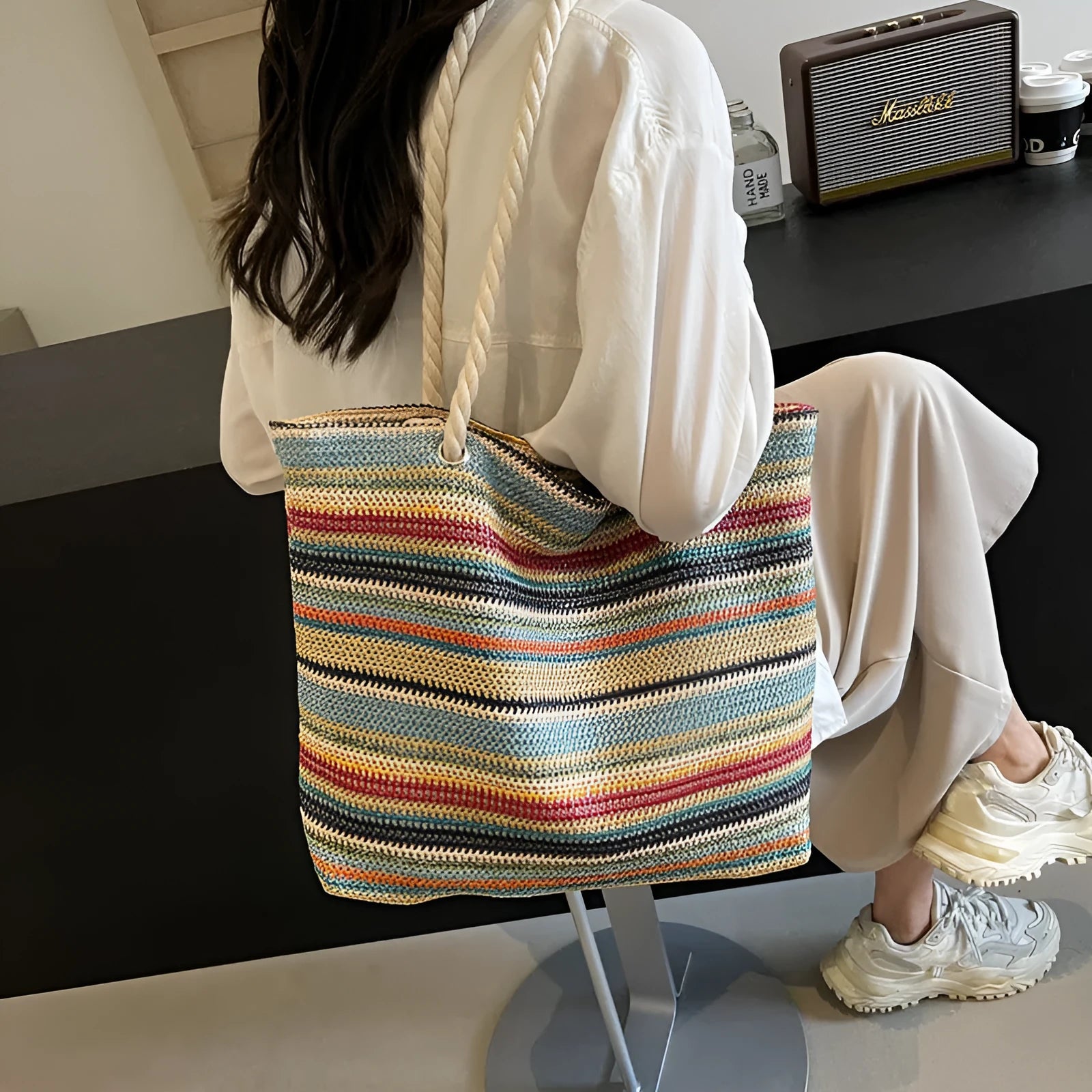 Blue straw woven large capacity single-shoulder bag with nylon construction.