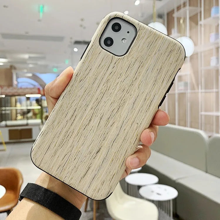 Wooden iPhone case with natural wood grain showing rosewood finish on iPhone 11 Pro