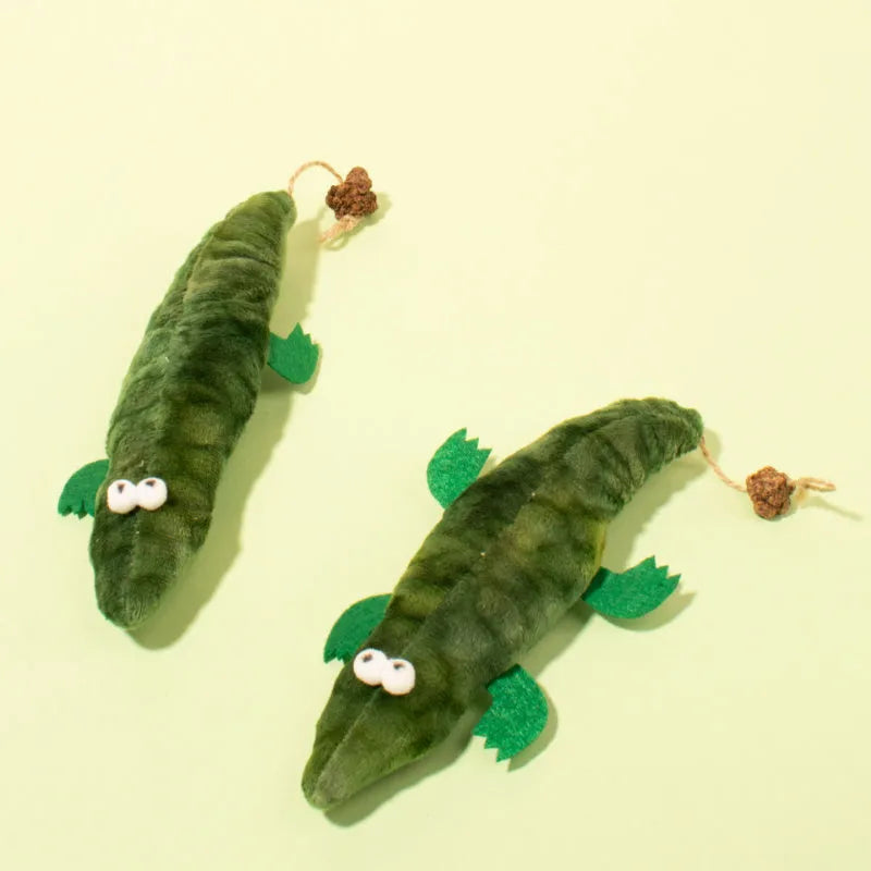 Green plush alligator catnip toy with plant-based filling for feline oral cleansing and stress relief
