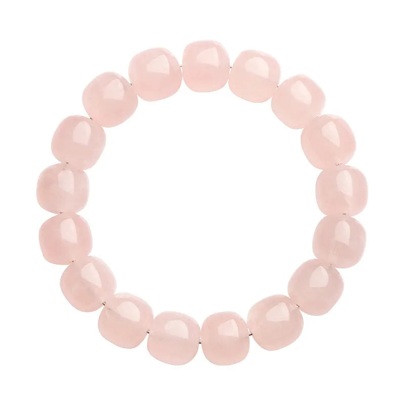 Pink crystal barrel bead bracelet with 11mm to 12mm geometric beads on natural background