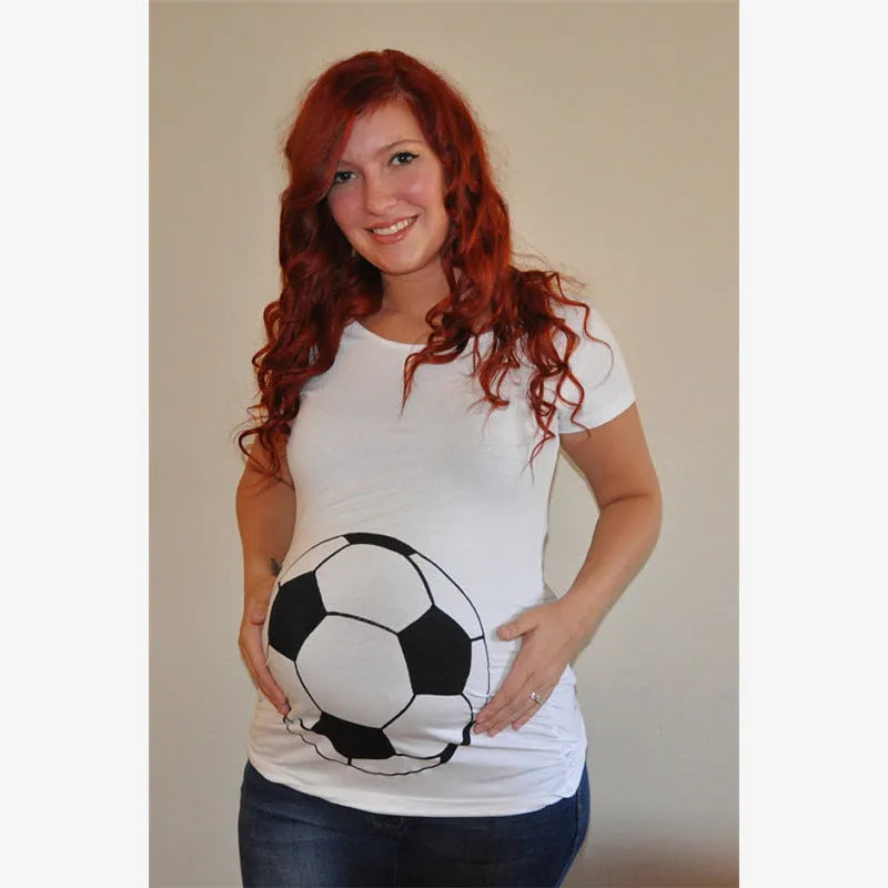 White cotton maternity t-shirt with hand print pattern, round collar, short sleeves on model