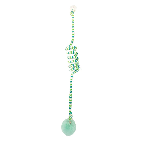 Hanging cat toy with bell stick and red inflatable ball attached to a glass door by a suction cup.