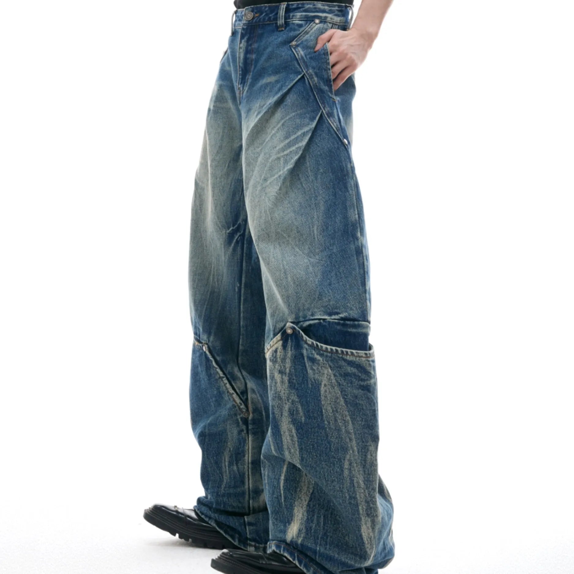 Men's verdant blue retro jeans with a curved knife cut and washed burst pattern