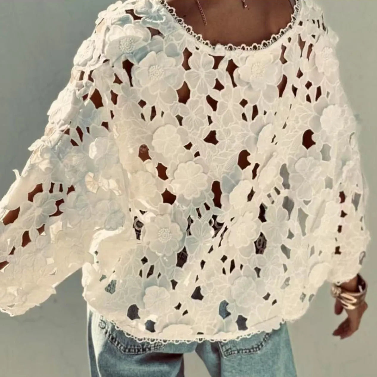 Women's black V-neck lace cardigan blouse with hollow long sleeves and three-dimensional decoration.