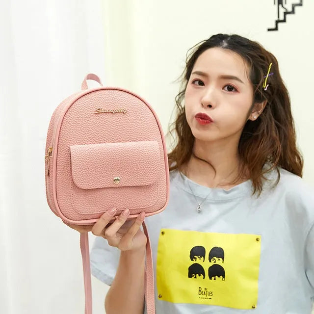 Women's small black PU leather backpack letter purse with shoulder strap measuring 18.5cm long