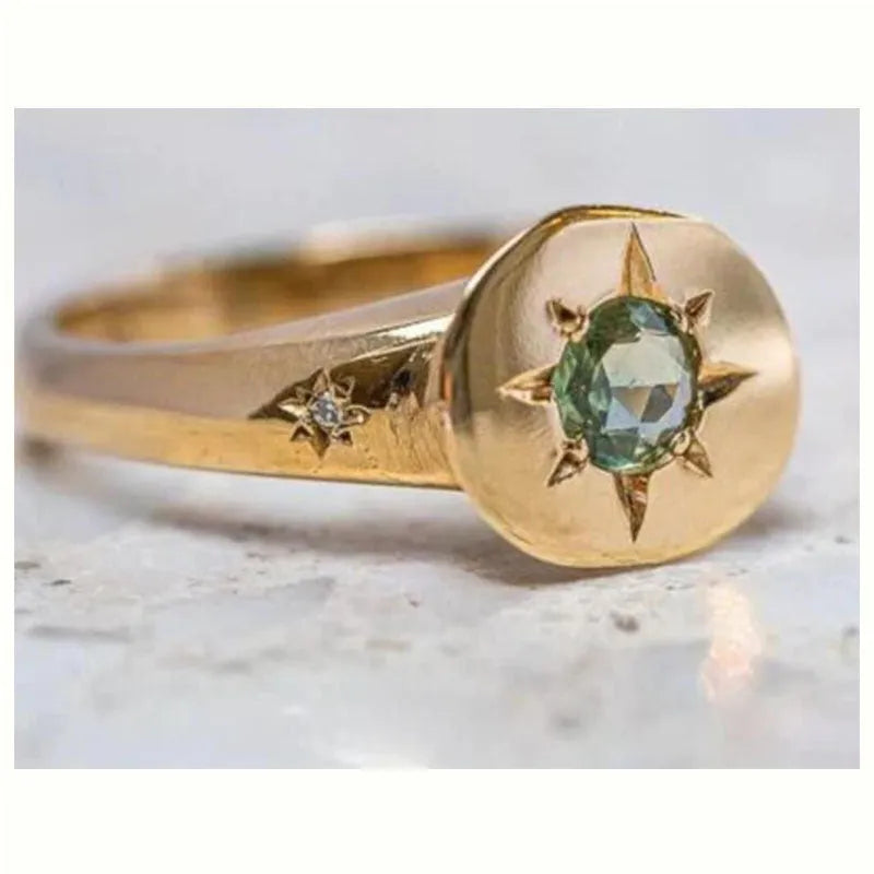 Golden adjustable ring with star design and oval asterism zircon pattern