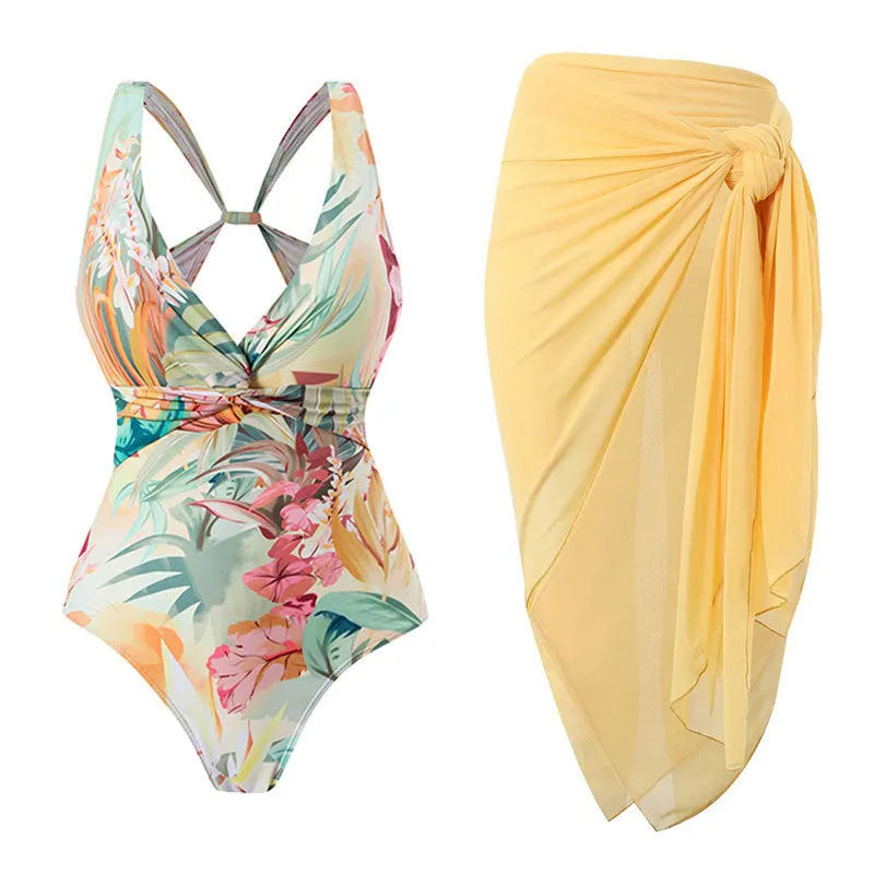 Women's vintage print one-piece swimsuit with short sleeves in a yellow floral pattern.