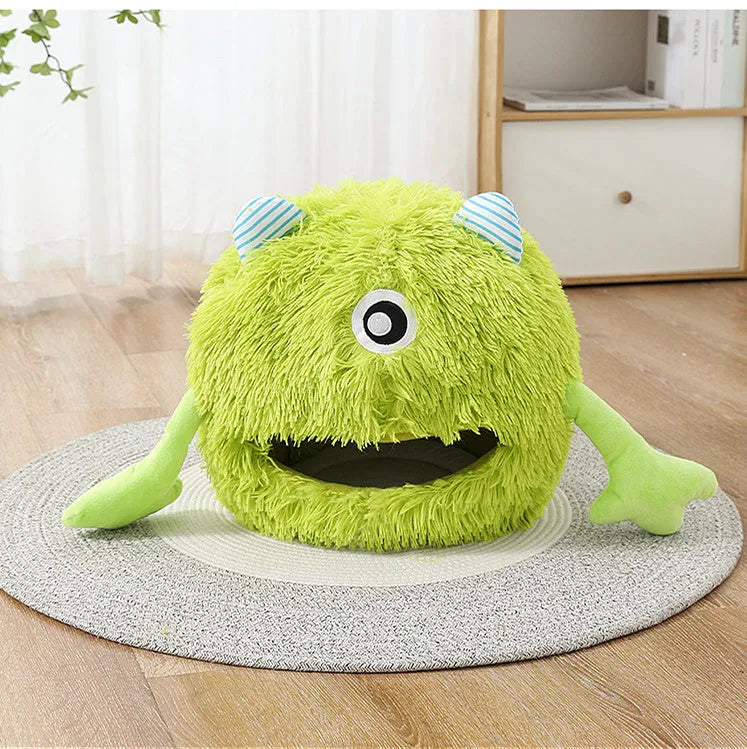 A round fluffy plush pet bed for cats and small dogs on a wooden floor.