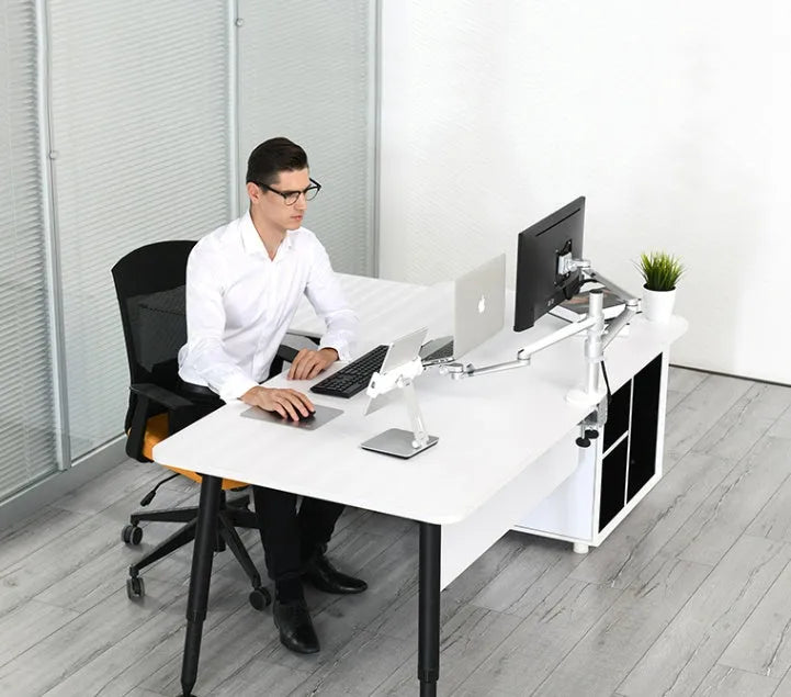 Folding aluminium desktop phone and tablet stand with 360-degree rotation on a wooden desk.