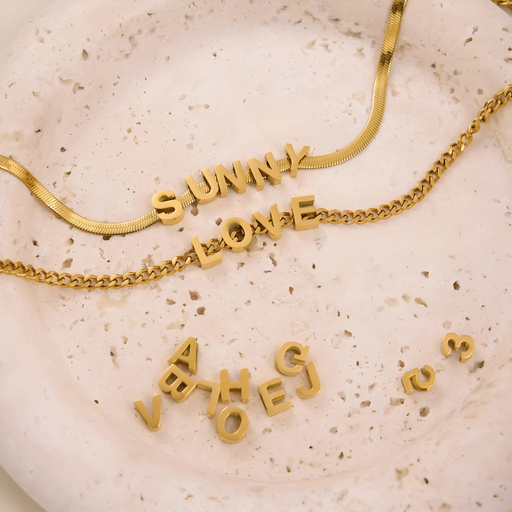 Titanium steel personalised necklace showing letter pendant on 40.5cm chain with electroplated gold finish