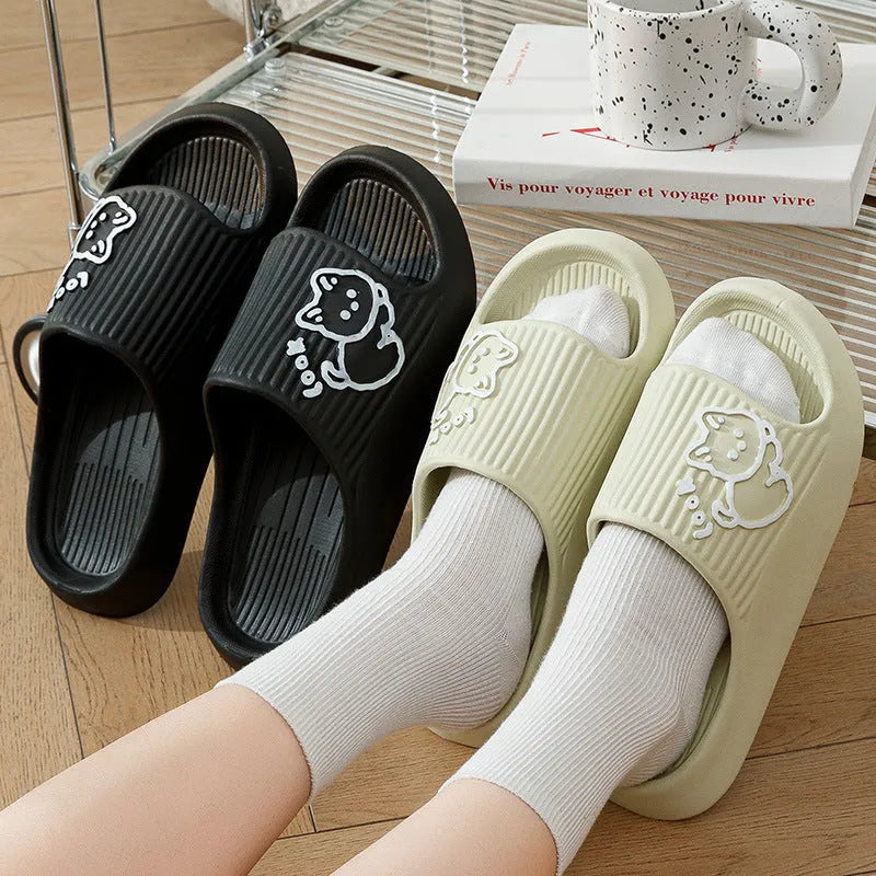 Women's green cat slippers with thick EVA platform sole, shown from above.