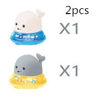 Automatic water spray whale bath toy floating in water with fountain and LED lights