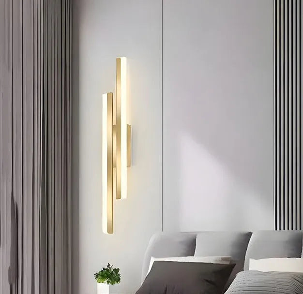 Modern gold double line wall lamp mounted on a wall, 500mm long with linear lighting.