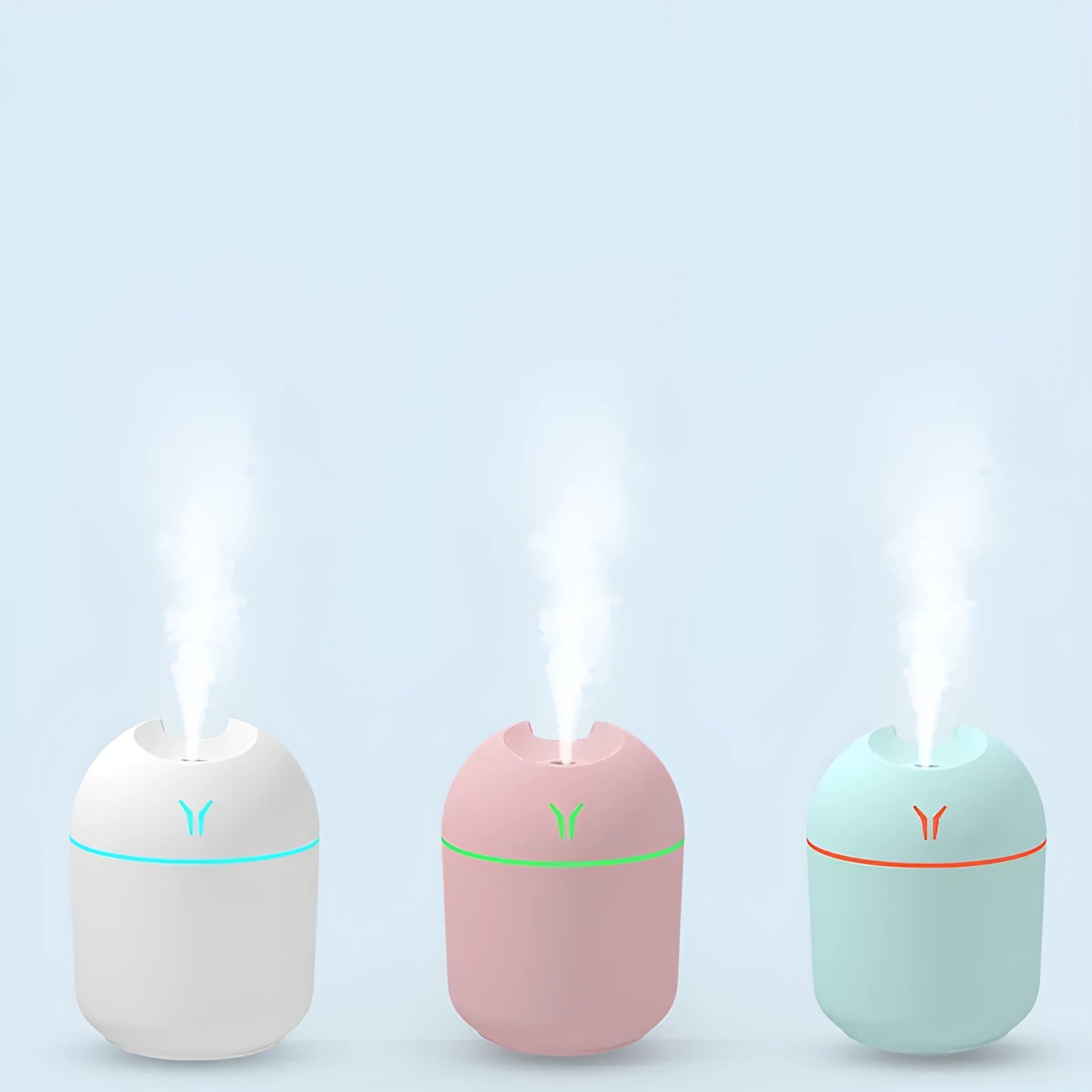 Round desktop humidifier with USB cable in ivory white, sky blue, and girlish pink colour options