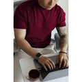 Men's slim-fit solid colour t-shirt on a hanger, available in multiple colours including black, navy, and camel.