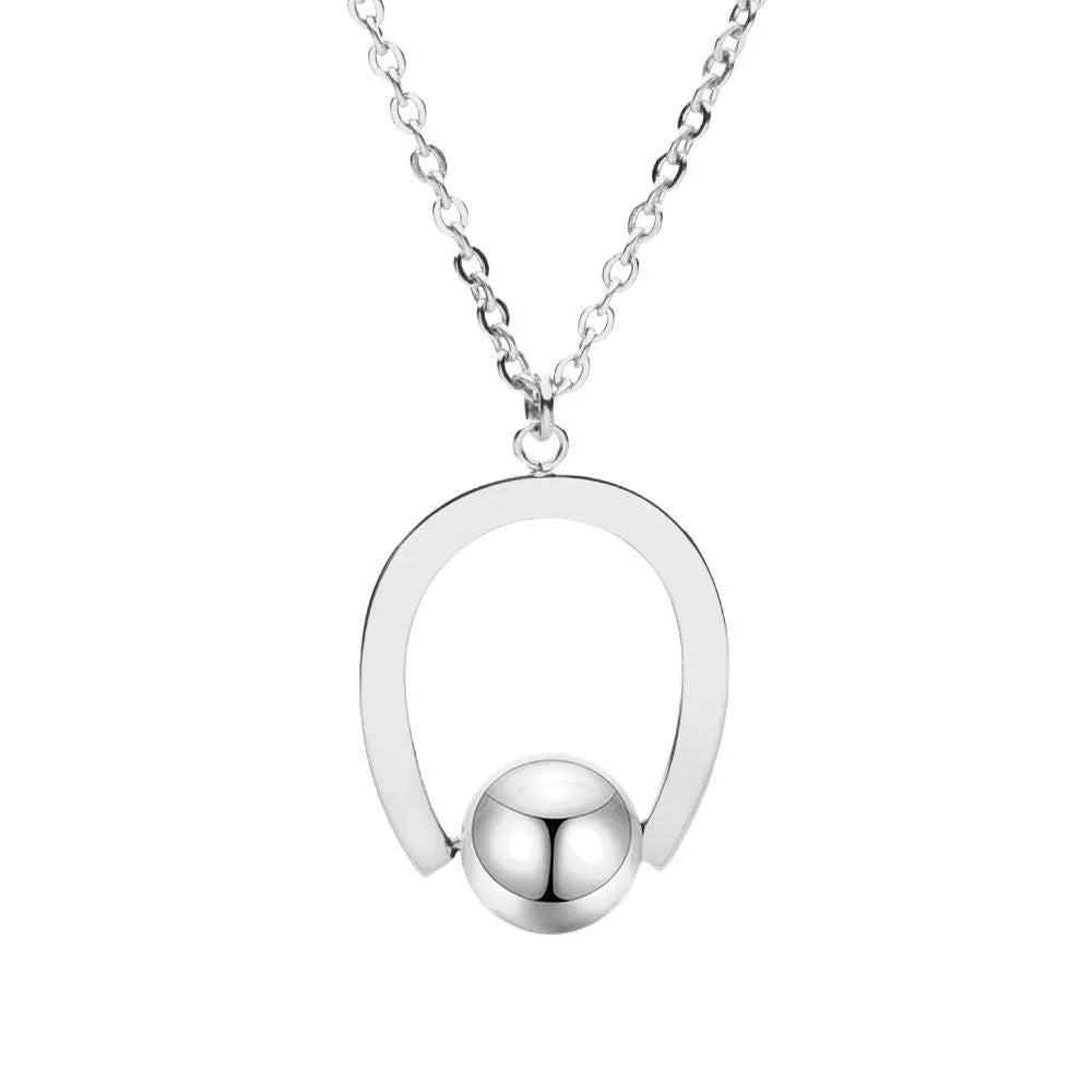 Stainless steel necklace with geometric pendant on adjustable cross chain in gold or silver finish