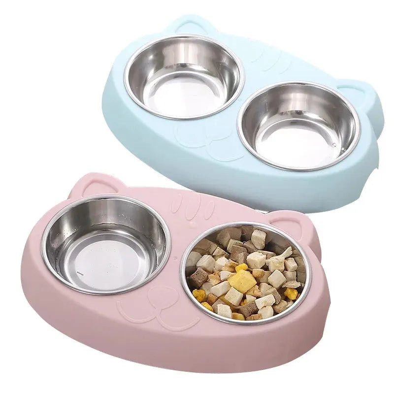 Blue plastic dual-bowl pet feeder tray for cat food and water on a white background.