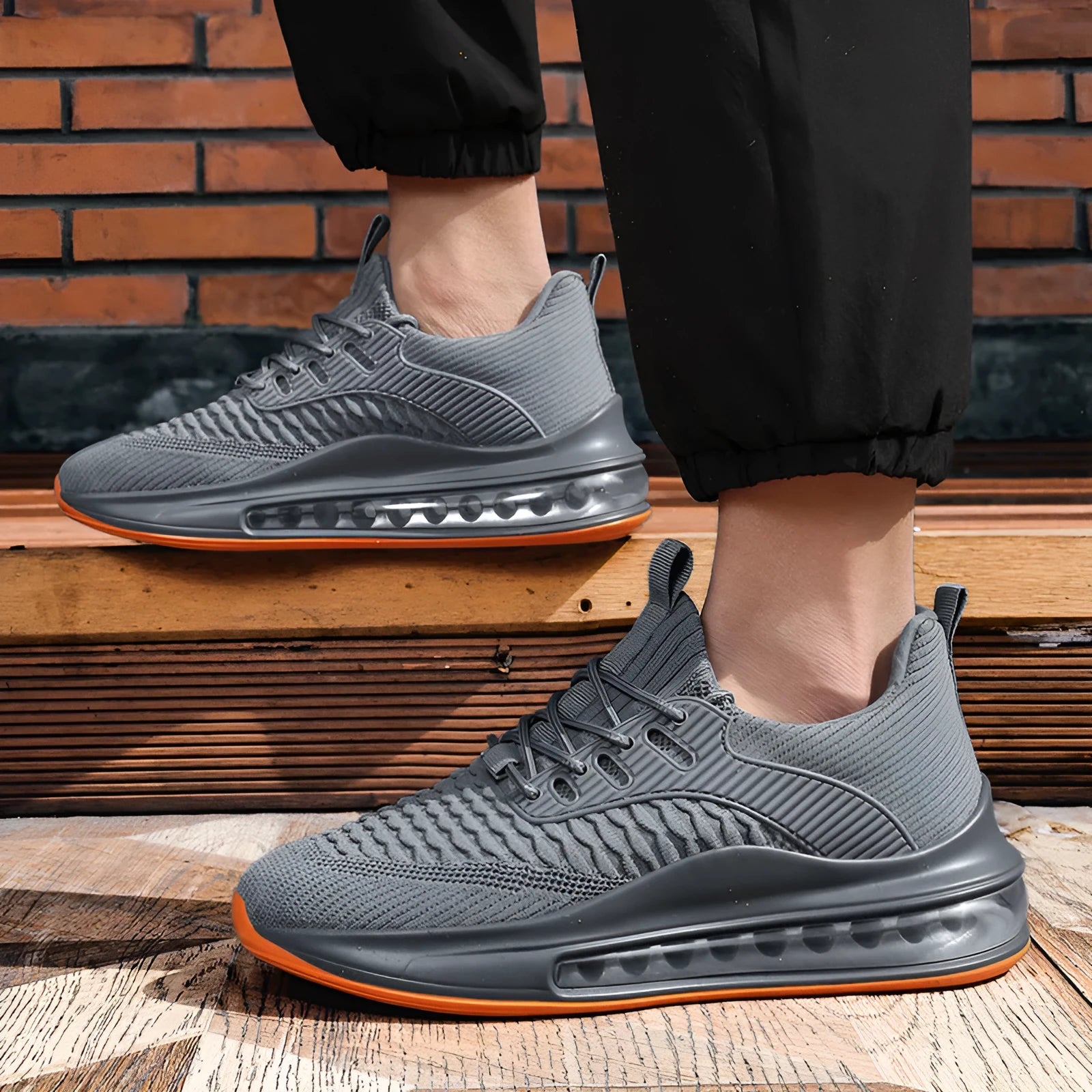Men's black low-top mesh running shoes with white rubber sole and lace-up front.