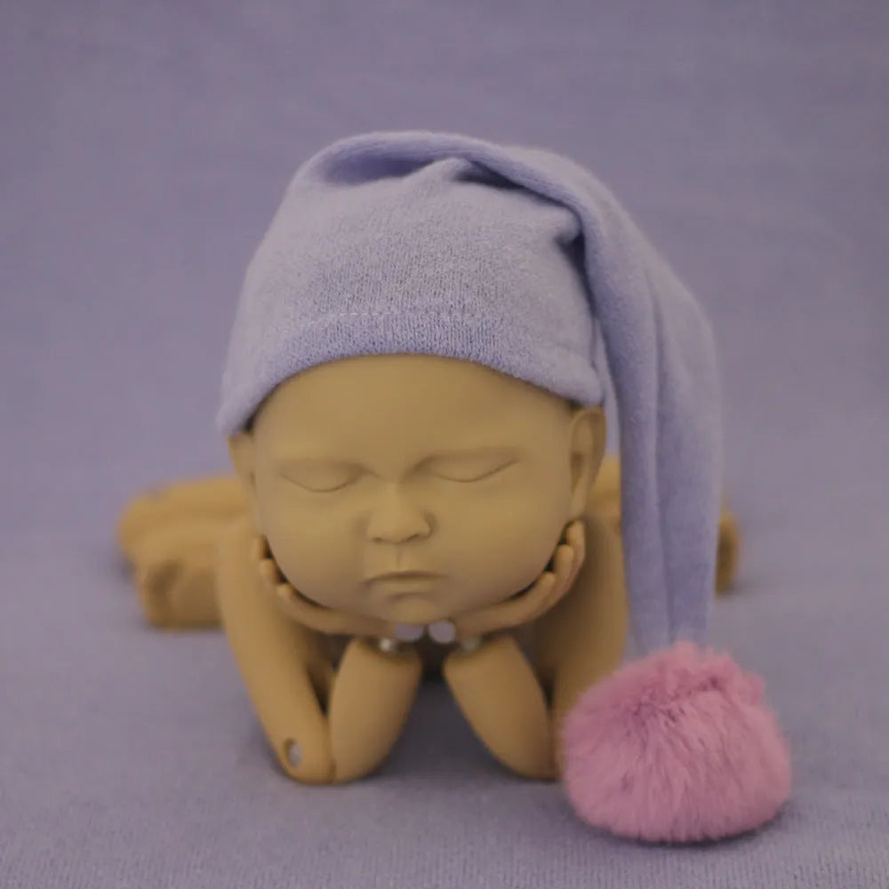 Hand-woven yarn baby photography hat in conical style, available in twelve colour options