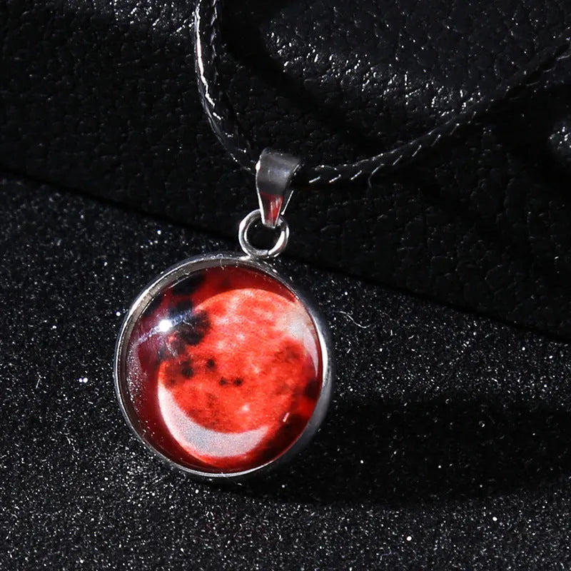 Luminous constellation pendant necklace with adjustable chain on a plain background.
