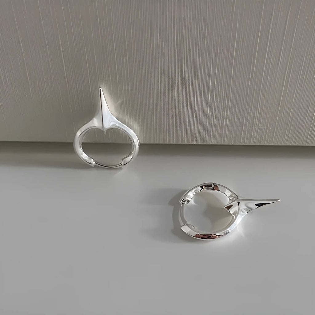 Geometric star shaped women's ear clips with electroplated copper white gold finish in platinum colour