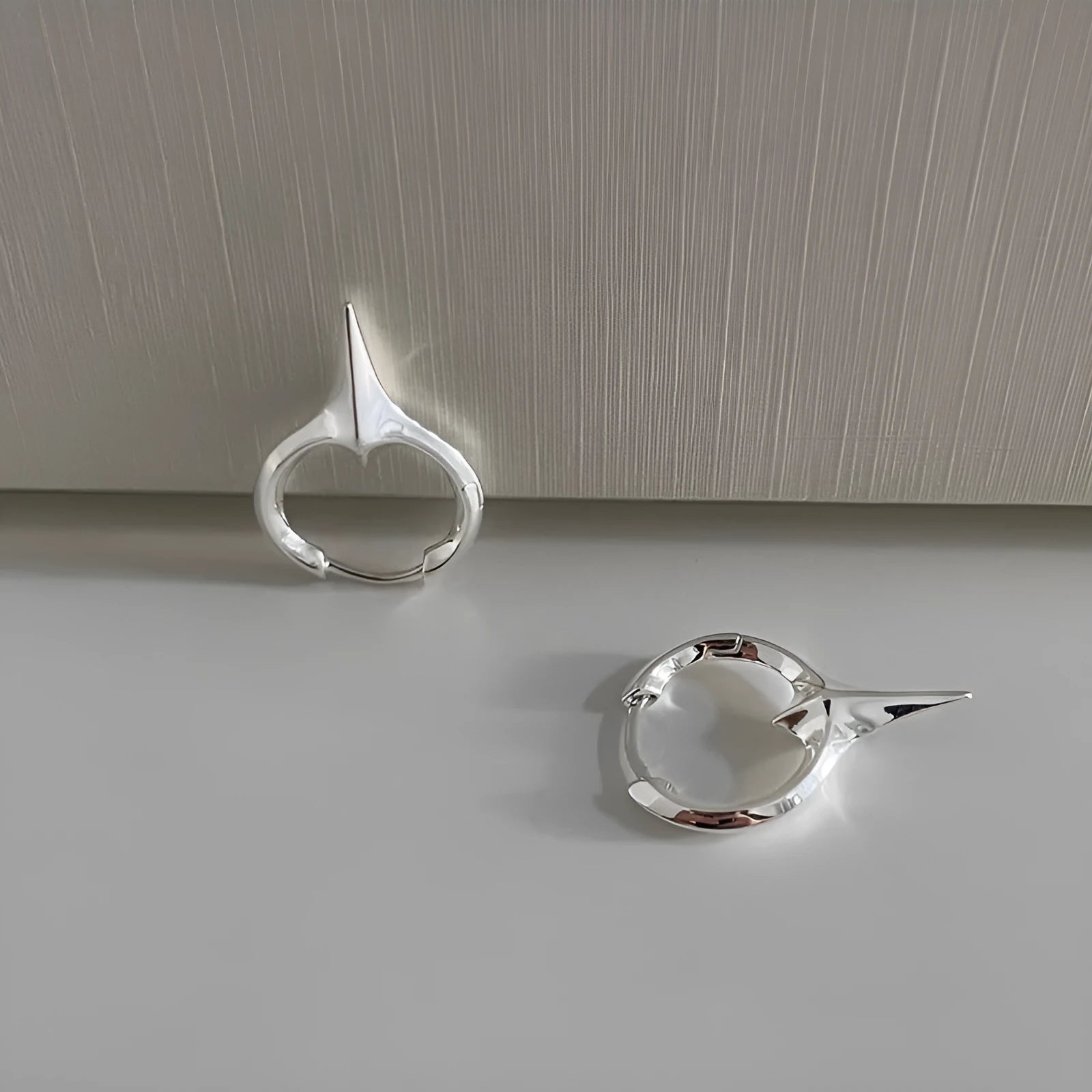Geometric star shaped women's ear clips with electroplated copper white gold finish in platinum colour