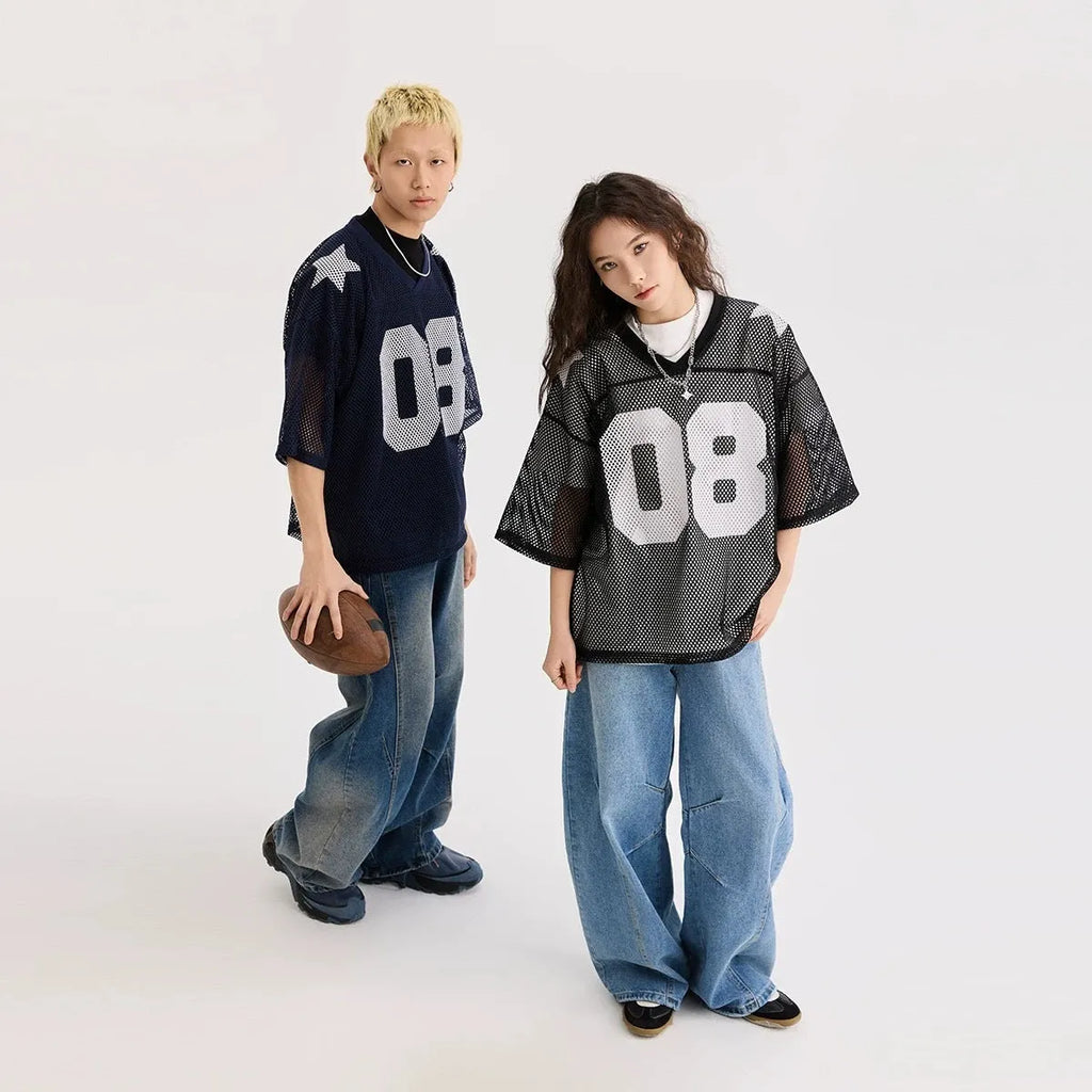 Black loose fit pullover shirt with white letter pattern design, short sleeves.