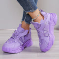 Women's purple platform sneaker with breathable mesh upper and lace-up front on a neutral background.