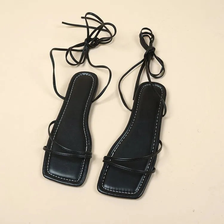 Women's flat sandals with ankle ring bandage strap and square toe in white, black, or orange red.