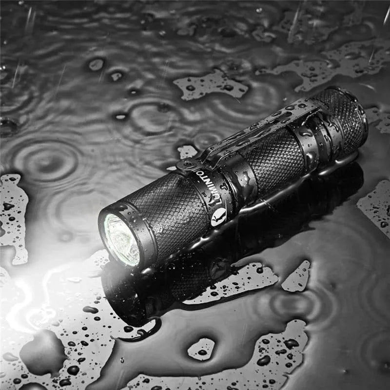 Lumintop Tool AA2.0 black keychain flashlight with tail switch and pocket clip on white background
